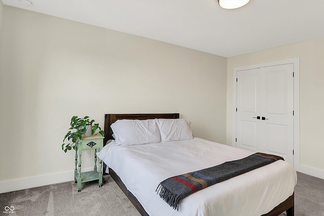 carpeted bedroom with baseboards