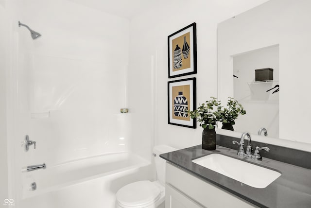 bathroom with shower / bathing tub combination, toilet, and vanity