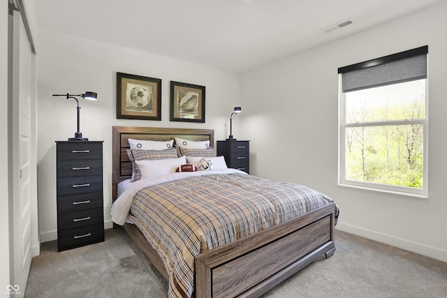 bedroom with visible vents, baseboards, and carpet floors