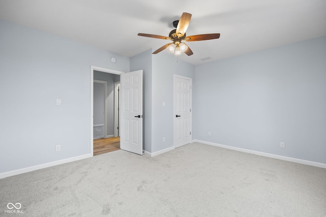 unfurnished bedroom with baseboards, ceiling fan, and carpet flooring