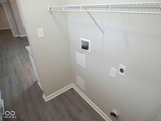 laundry area featuring laundry area, hookup for an electric dryer, baseboards, and wood finished floors