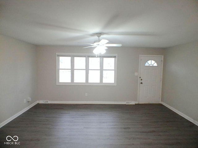 entryway with baseboards, ceiling fan, and dark wood-style flooring