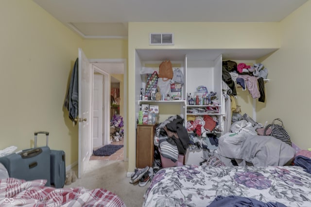 carpeted bedroom featuring visible vents