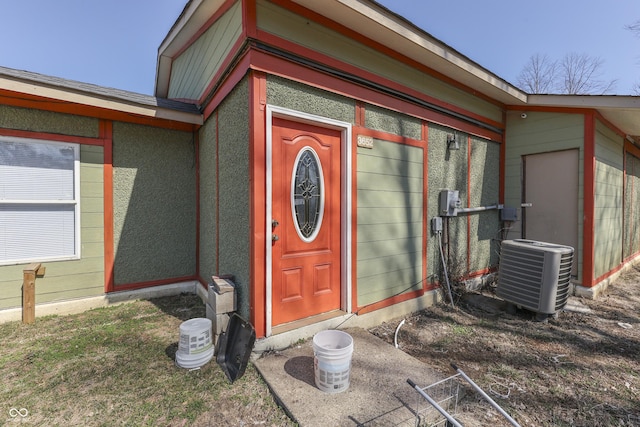 doorway to property featuring cooling unit