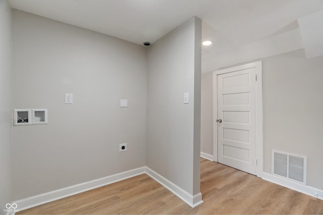 washroom with hookup for a washing machine, baseboards, visible vents, electric dryer hookup, and light wood-style floors