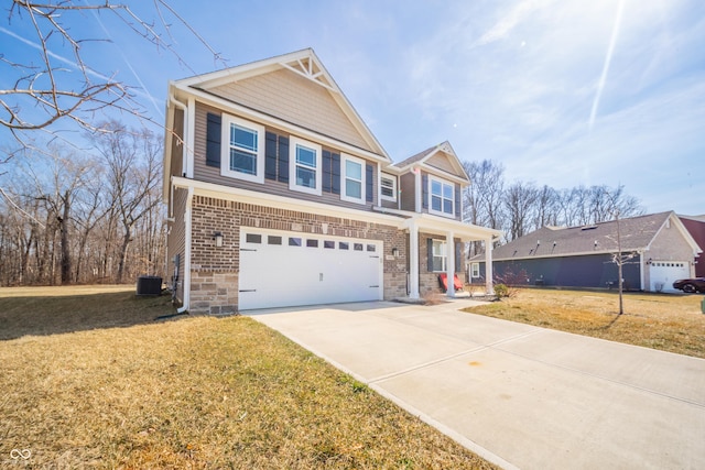 view of front facade with a front lawn, concrete driveway, brick siding, and a garage