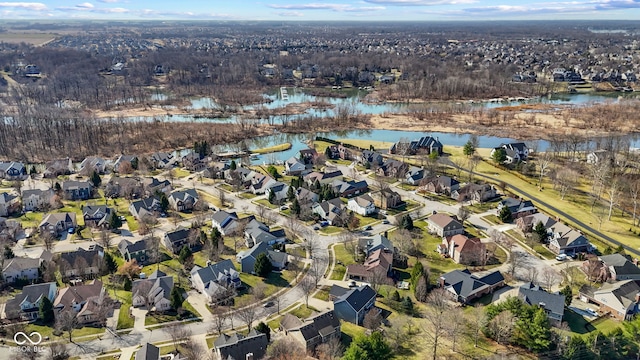 drone / aerial view featuring a residential view and a water view