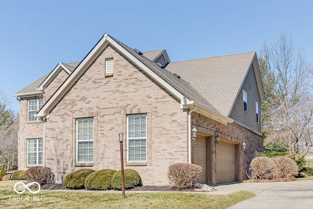 view of front of property with brick siding, driveway, an attached garage, and roof with shingles