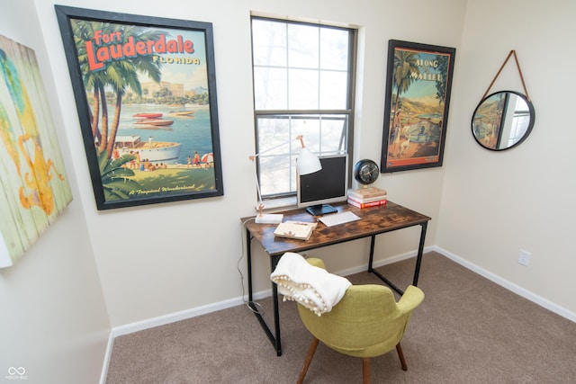 home office featuring baseboards and carpet