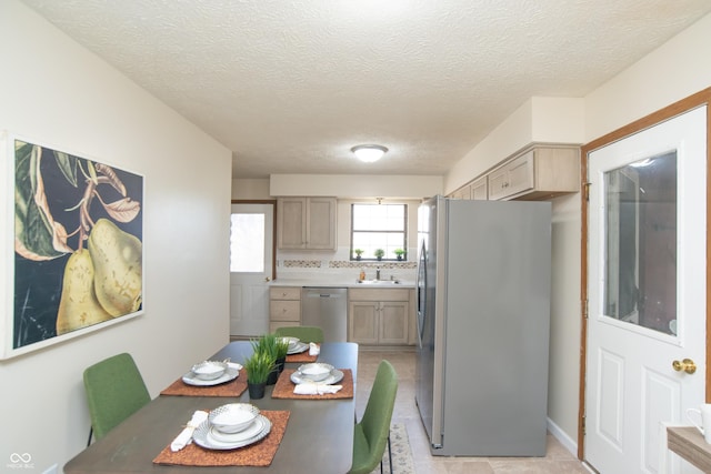 dining space featuring a textured ceiling