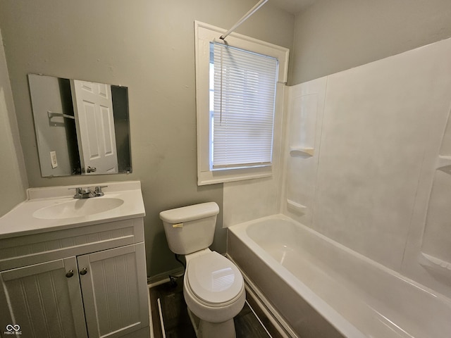 bathroom featuring vanity, shower / bathing tub combination, toilet, and baseboards