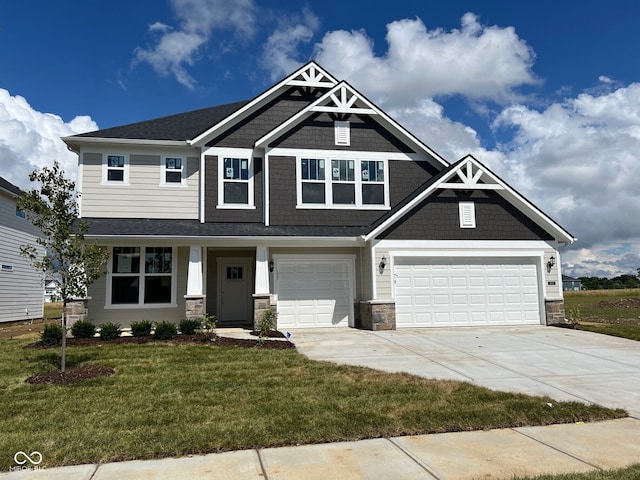 craftsman inspired home featuring a garage, stone siding, concrete driveway, and a front yard