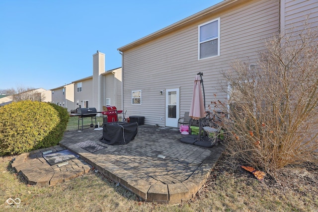 rear view of property featuring a patio area