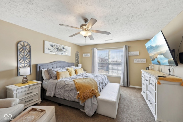 bedroom featuring visible vents, a textured ceiling, carpet floors, baseboards, and ceiling fan