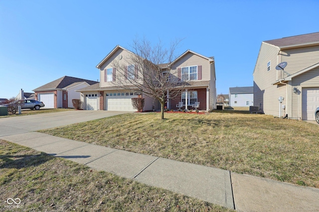 traditional home featuring brick siding, a front lawn, concrete driveway, cooling unit, and a garage