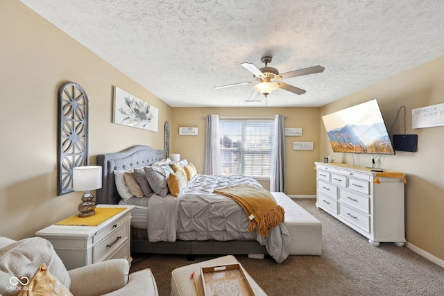 bedroom with baseboards, carpet, a ceiling fan, and a textured ceiling