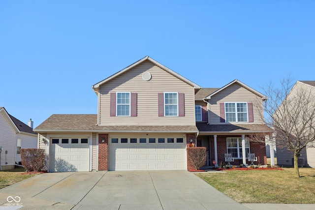 traditional-style home featuring brick siding, concrete driveway, a front lawn, and roof with shingles