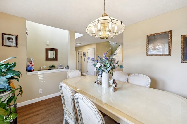 dining room featuring stairway, an inviting chandelier, baseboards, and wood finished floors