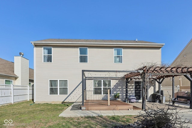 rear view of house featuring a patio area, a lawn, a pergola, and fence