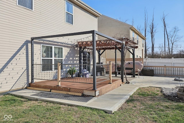 deck with fence and a pergola