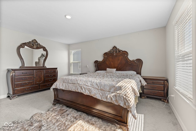 bedroom with carpet flooring and baseboards