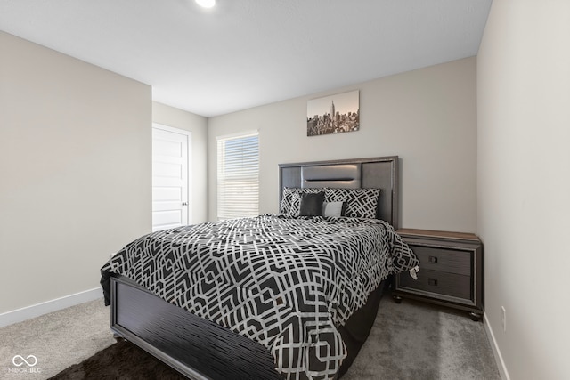 carpeted bedroom with baseboards