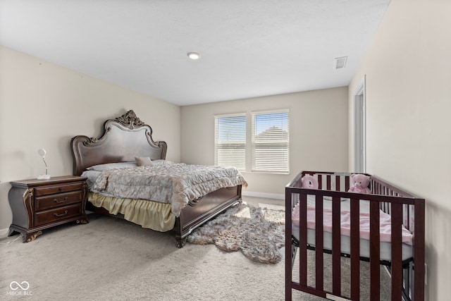 bedroom featuring carpet flooring, baseboards, and visible vents