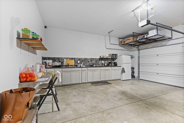 garage with freestanding refrigerator