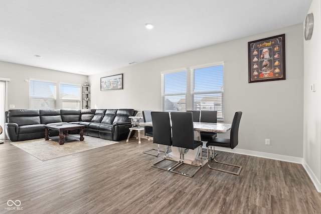 living room with baseboards and wood finished floors