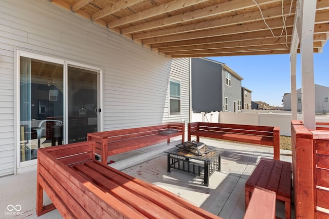 wooden terrace featuring fence