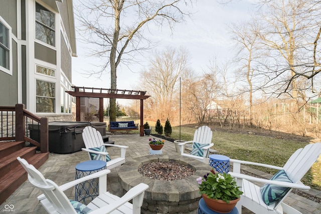 view of patio with a fire pit, a pergola, and a hot tub