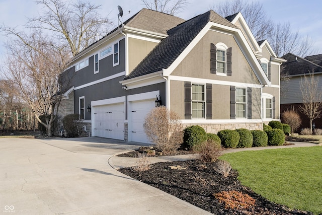 view of home's exterior featuring an attached garage, stucco siding, a lawn, stone siding, and driveway