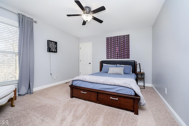 bedroom with a ceiling fan, carpet, and baseboards