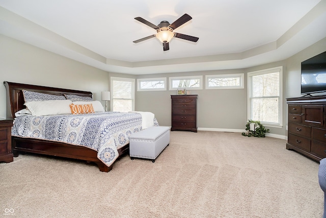 bedroom with a ceiling fan, multiple windows, carpet, and baseboards