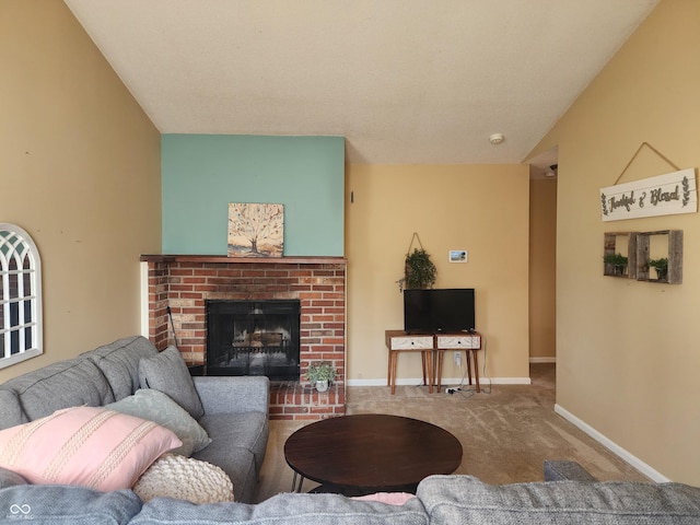 carpeted living room with baseboards, lofted ceiling, and a brick fireplace