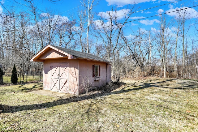 view of shed with fence