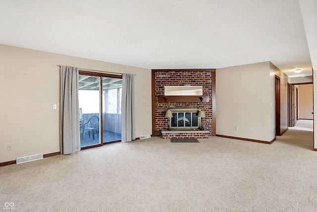 unfurnished living room with baseboards, visible vents, and carpet floors