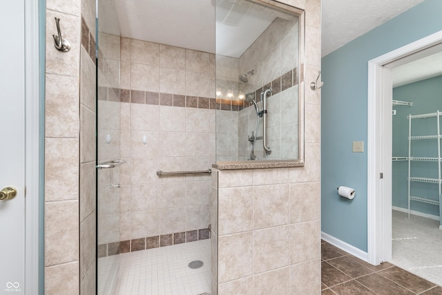 bathroom featuring baseboards and a walk in shower