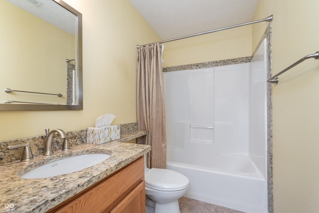 full bathroom with vanity, shower / bath combo, a textured ceiling, tile patterned floors, and toilet