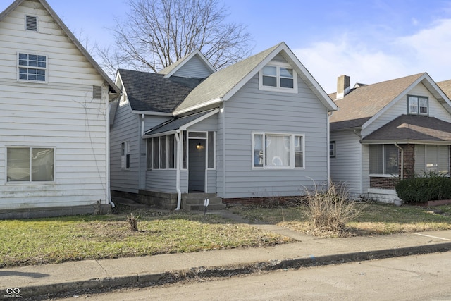 view of front of home featuring a shingled roof