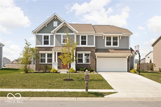 craftsman inspired home with driveway, a front yard, and fence