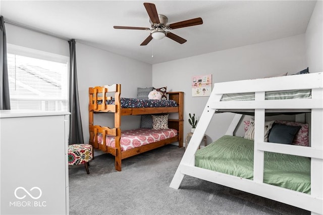 carpeted bedroom with a ceiling fan