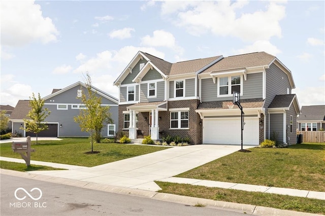 craftsman house featuring a front lawn, an attached garage, brick siding, and driveway