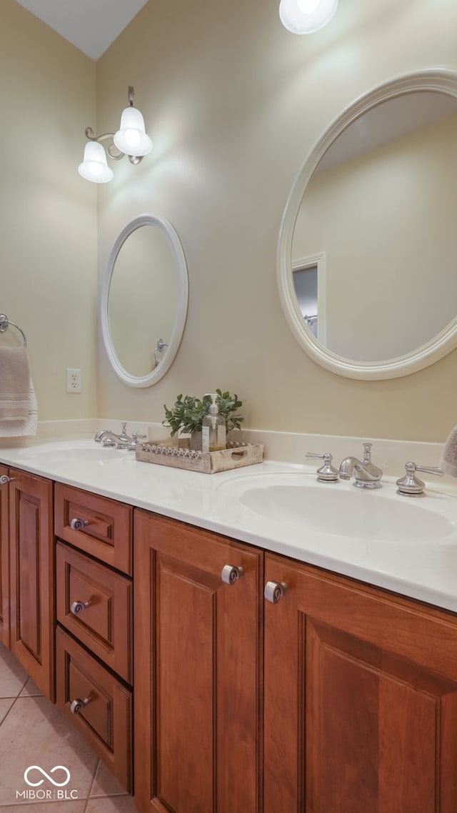 bathroom with tile patterned flooring, double vanity, and a sink