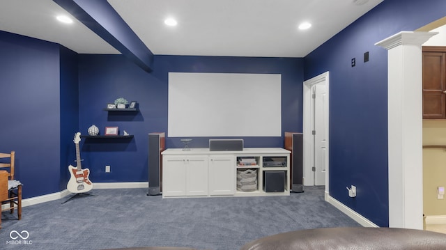 carpeted home theater room with recessed lighting, baseboards, and decorative columns