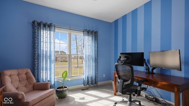 home office with carpet flooring, wallpapered walls, and baseboards