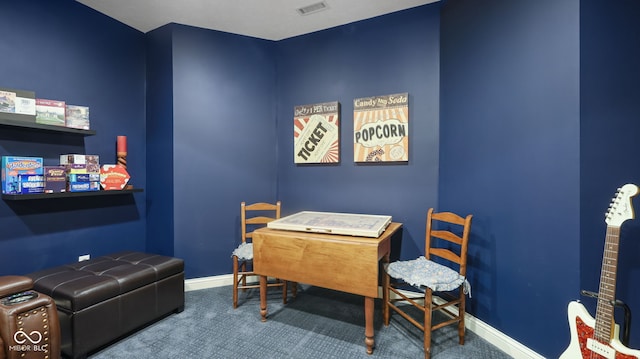 carpeted home office with baseboards and visible vents