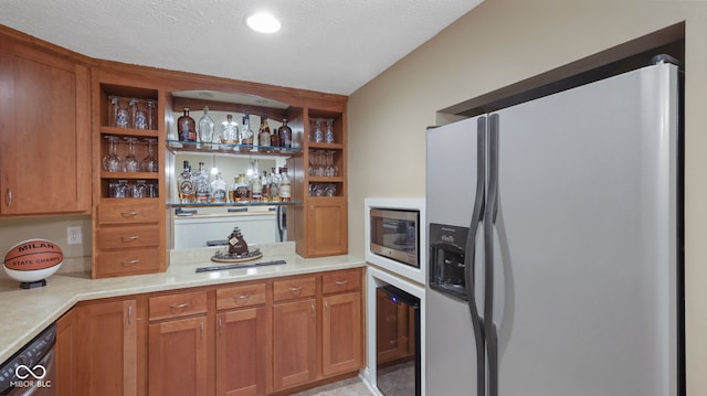 kitchen featuring a textured ceiling, light countertops, open shelves, and stainless steel appliances