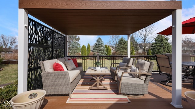 wooden terrace with an outdoor living space