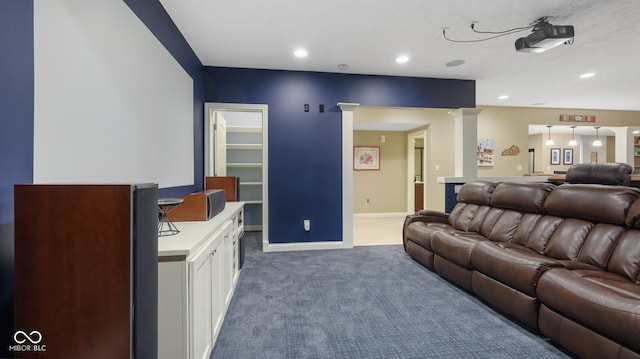 living area featuring carpet flooring, recessed lighting, baseboards, and decorative columns